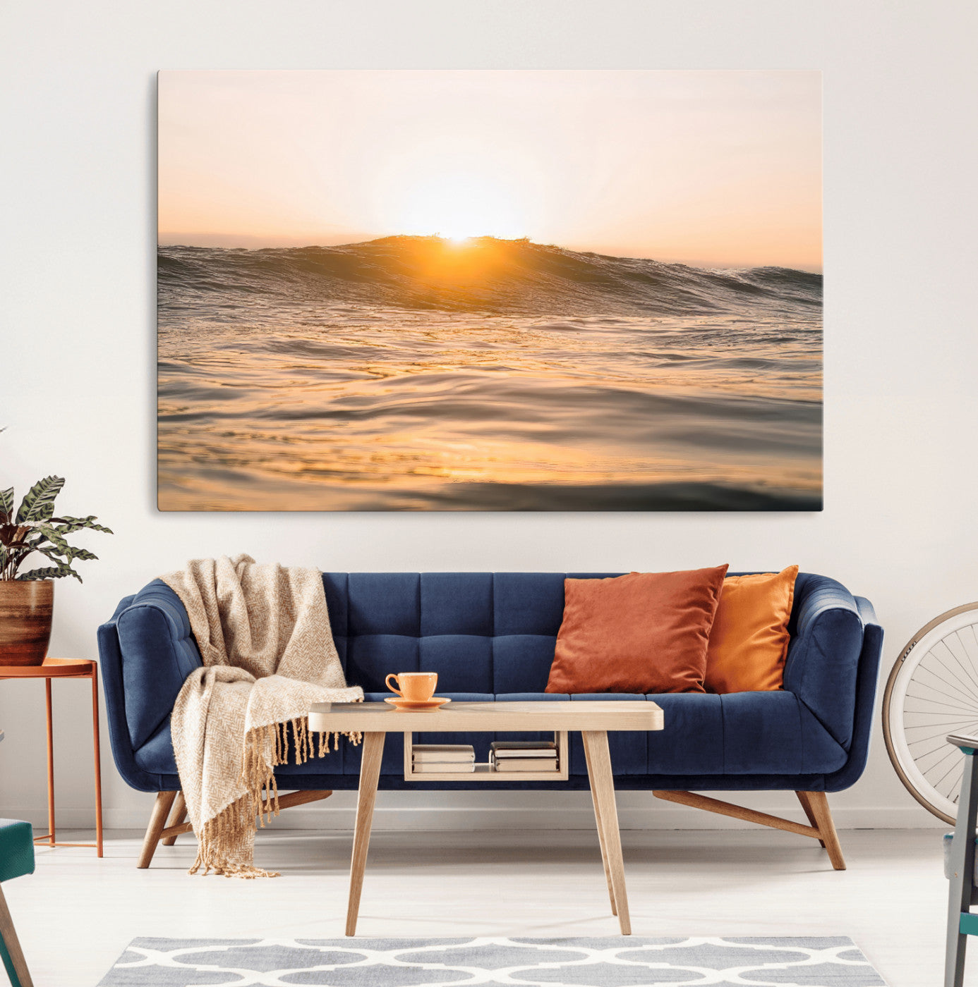 Ocean waves glowing under a warm golden sunset, reflecting soft light and calm movement, perfect for warm minimalist coastal interiors.