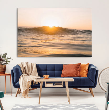 Ocean waves glowing under a warm golden sunset, reflecting soft light and calm movement, perfect for warm minimalist coastal interiors.