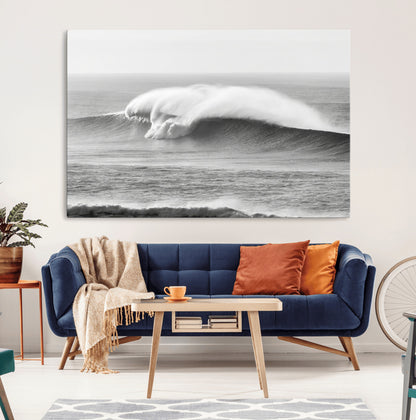 A dramatic black and white ocean wave crashing with immense force, capturing the raw power and movement of the sea in a bold seascape.