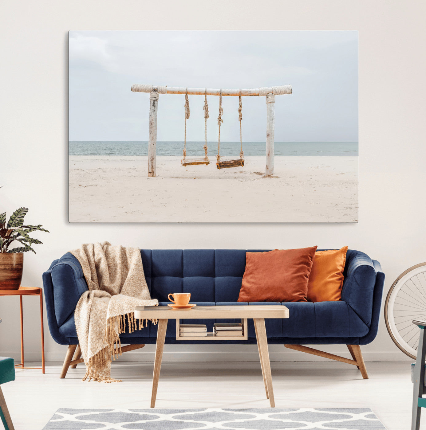 A rustic wooden beach swing stands on a serene sandy shore with an ocean horizon in the background, creating a tranquil and dreamy coastal escape.