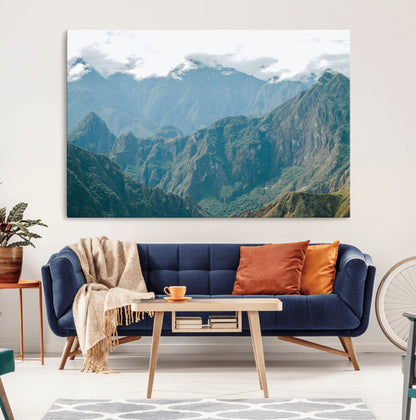 A misty mountain landscape with cloud-covered Andean peaks and lush green valleys, creating a dramatic and serene view, perfect for rustic or nature-inspired home decor.