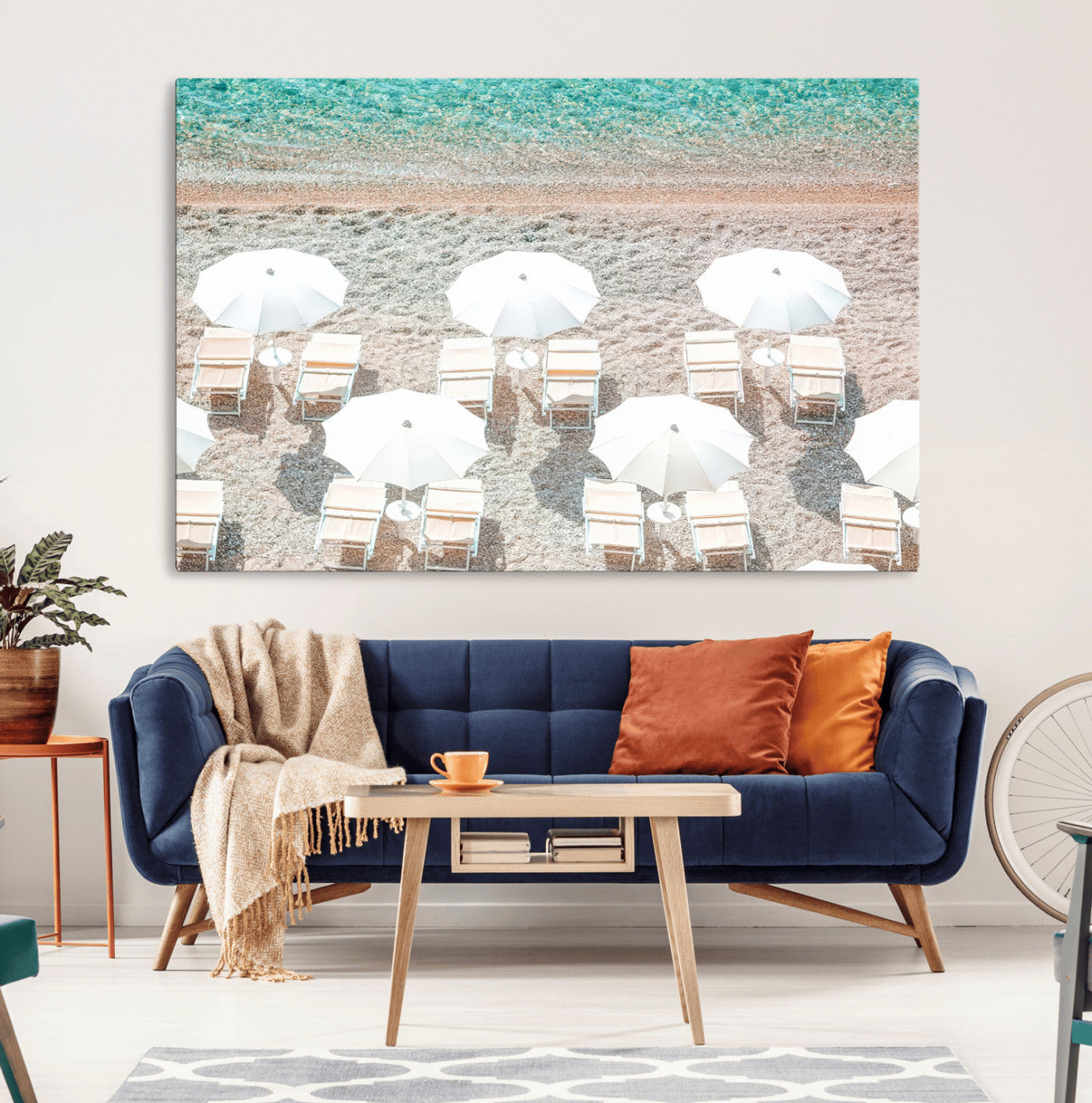 A bright beach scene with white umbrellas, pastel sand, and turquoise waters, creating a tranquil coastal vibe, perfect for beach house or summer decor.