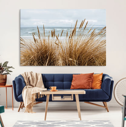 Canvas of golden beach grass swaying by the ocean under a soft cloudy sky, perfect for neutral-toned or coastal minimalist decor.