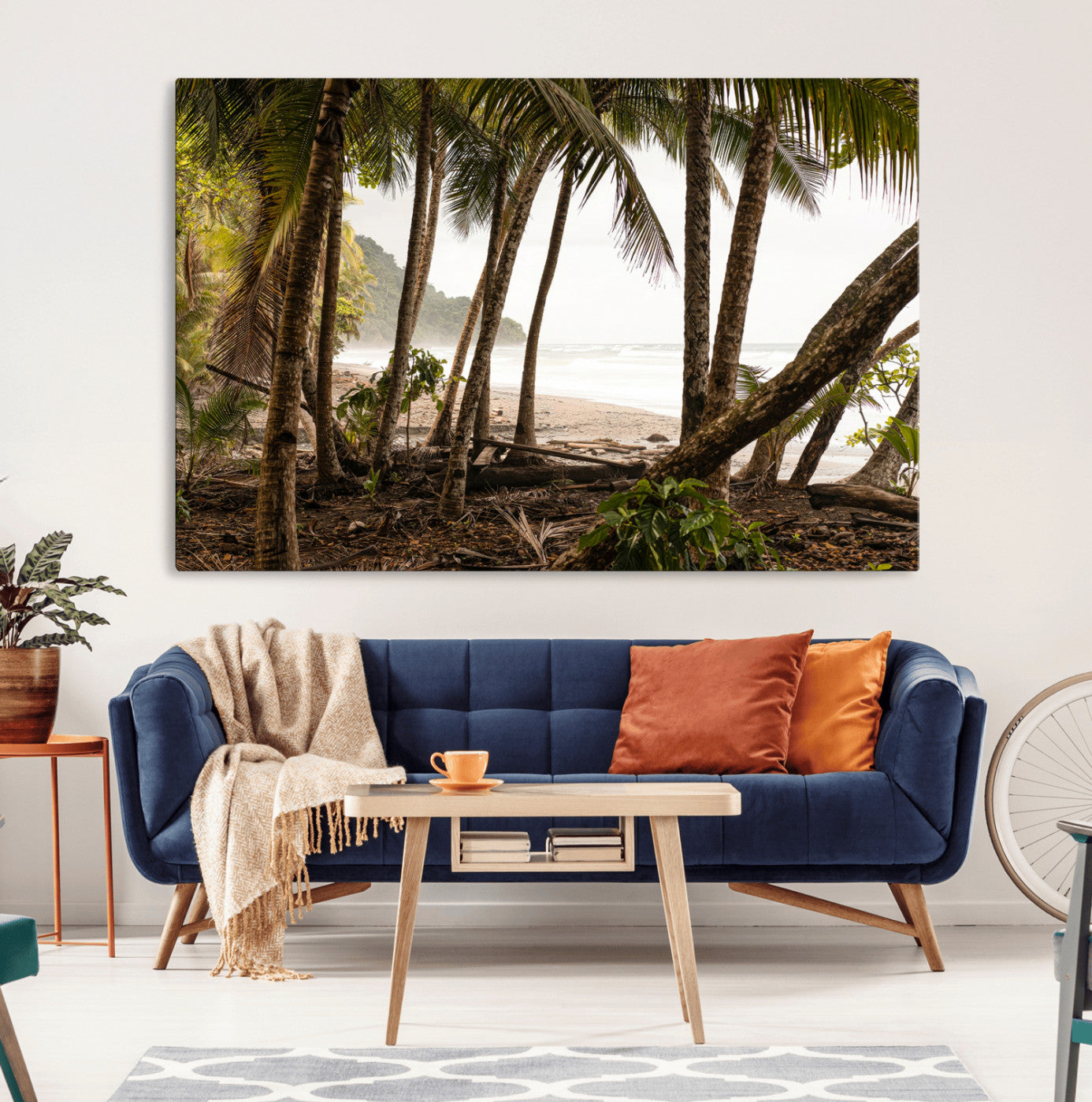 Dense tropical palm trees framing a sandy beach and ocean shore, ideal for jungle or coastal themed interior wall decor.