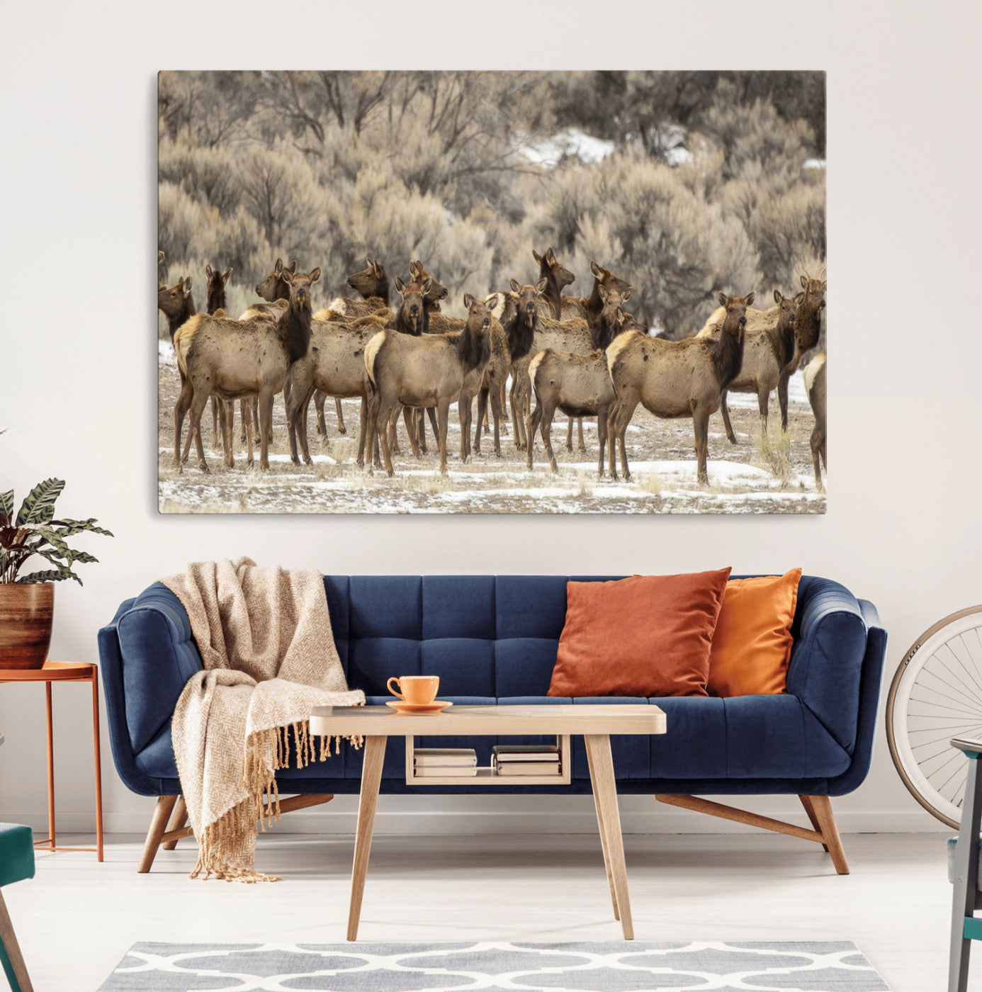 A large herd of elk standing in an open field with soft earthy tones, ideal for rustic lodge or western-themed home wall decor.