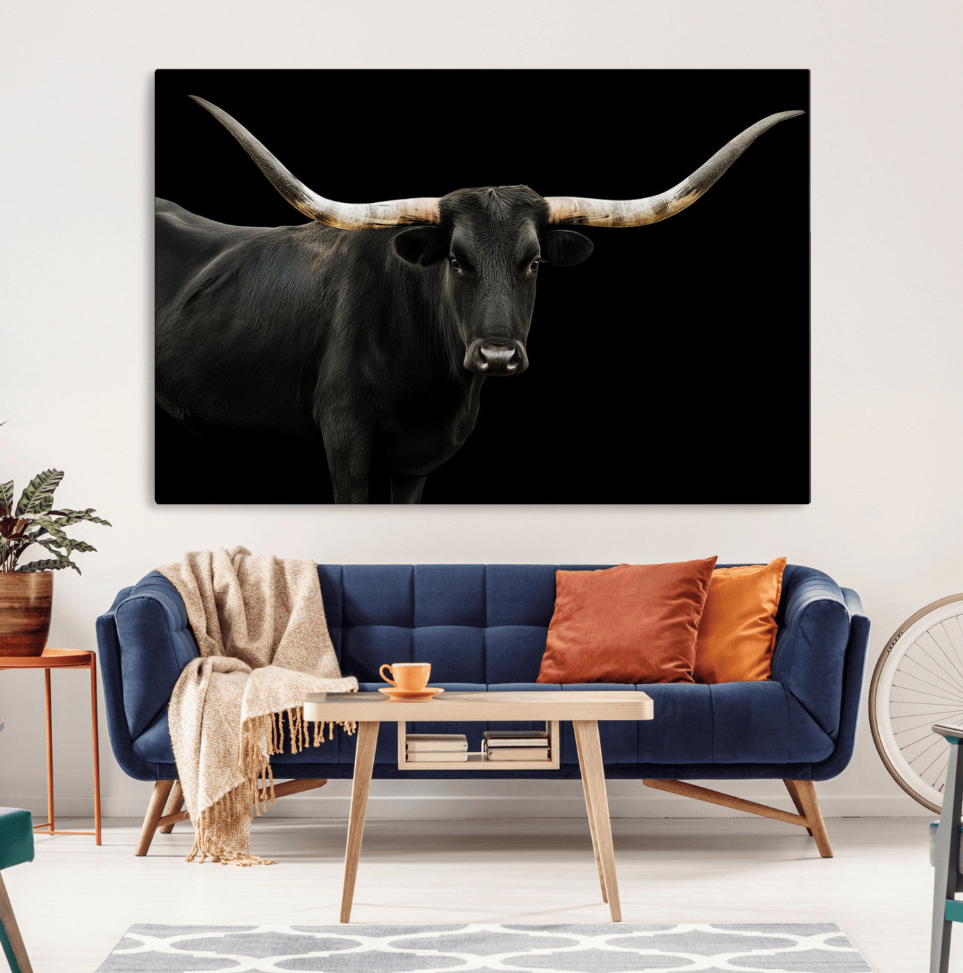 Close-up of a black Texas longhorn with large curved horns on black background, ideal for rustic farmhouse or modern western interiors.