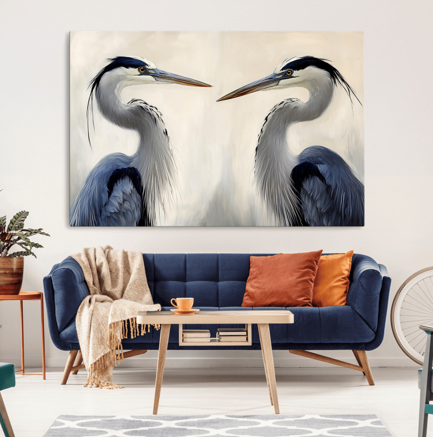 Two blue herons facing each other on a soft neutral background, ideal for coastal, tranquil, or nature-inspired minimalist interiors.