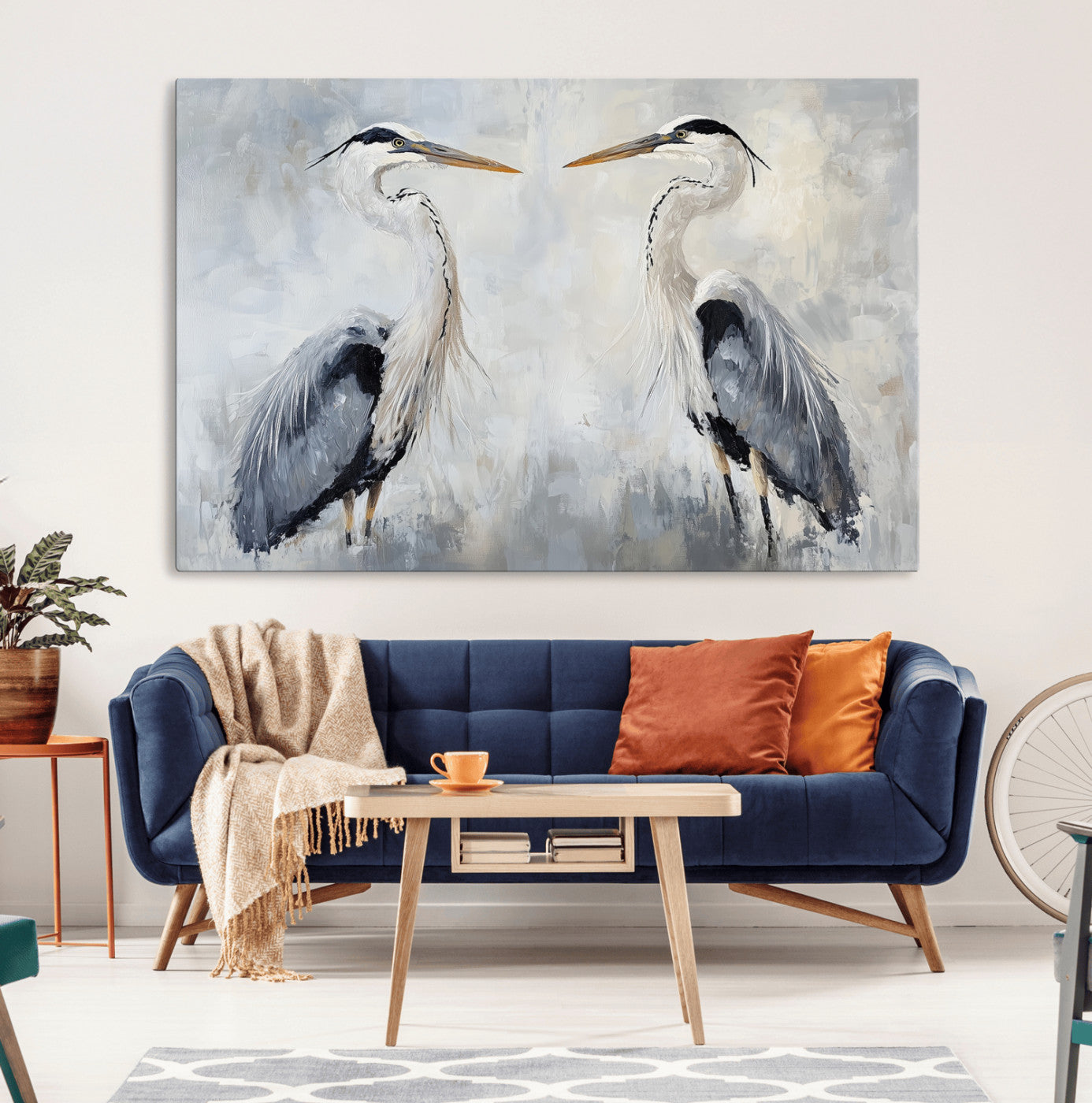 Two herons facing each other on a soft-toned background with blue-grey feathers, perfect for tranquil, coastal or nature-themed interiors.