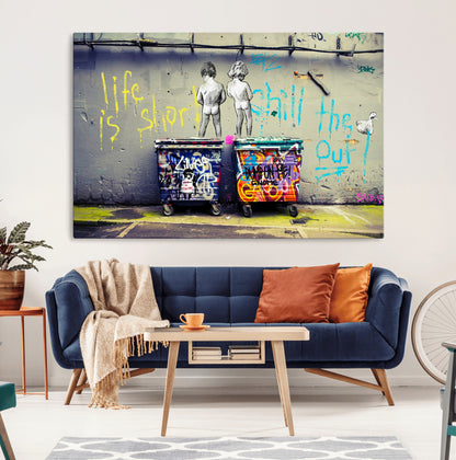 Graffiti-style canvas art with bold text and two naked figures over urban dumpsters, ideal for edgy or street-style decor.