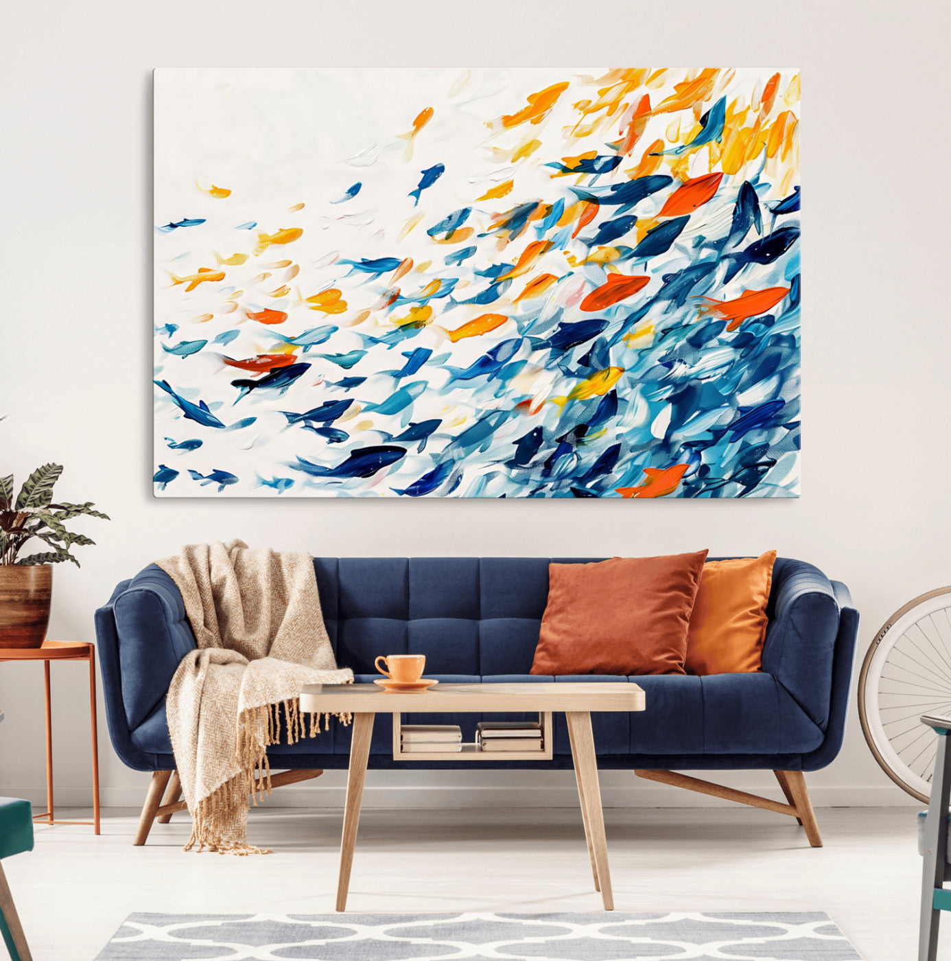 A modern abstract canvas featuring a dynamic school of colorful fish in blue, orange, and yellow tones, ideal for coastal or contemporary decor.