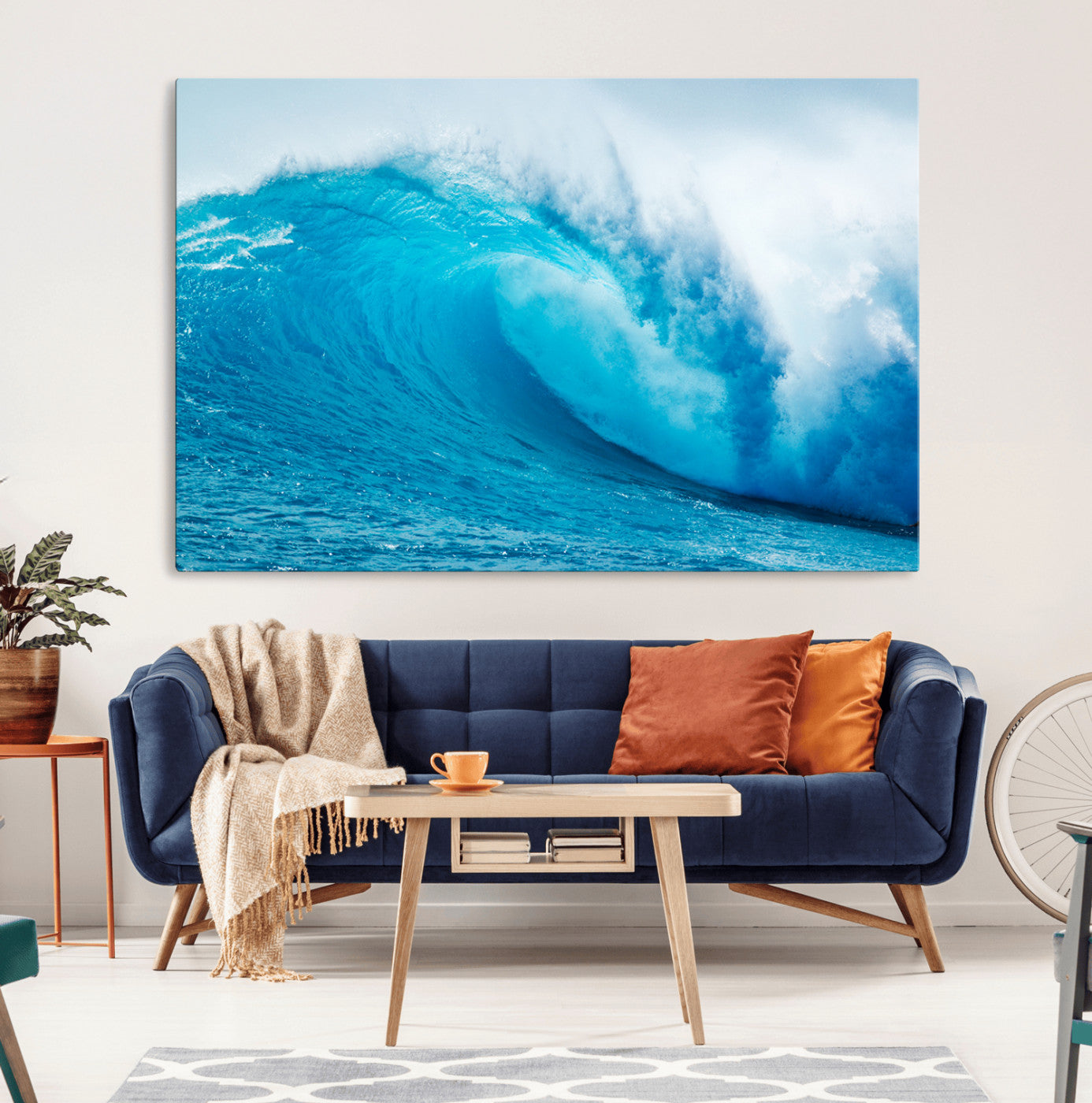 Vibrant canvas of a powerful curling ocean wave in tropical blue tones, perfect for coastal or surf-inspired decor settings.
