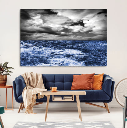 Moody canvas wall art of a stormy ocean under a dramatic black-and-white sky, perfect for bold or coastal-style interiors.