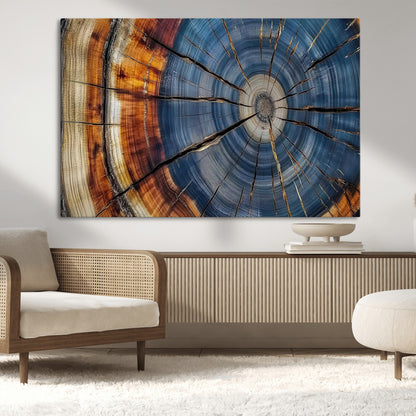 A stunning close-up view of a tree trunk, showcasing the intricate growth rings in a vibrant mix of warm browns, cool blues, and hints of natural texture.