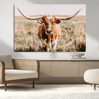 Framed longhorn cow canvas wall art with rustic prairie background, western animal print perfect for farmhouse or ranch style decor