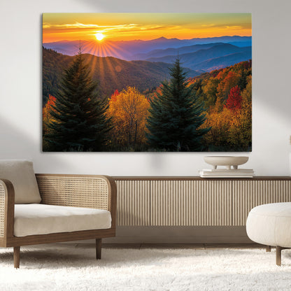 Vibrant sunset over autumn mountains with colorful trees and warm light, ideal for nature lovers or cabin-style wall decor.