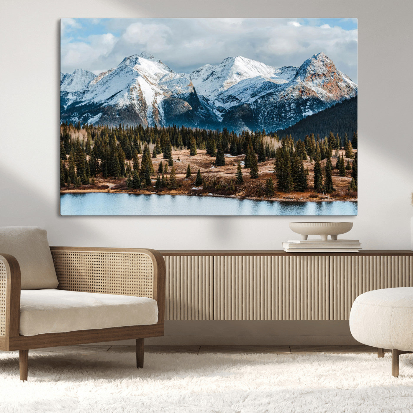 Framed canvas of snowy mountain peaks with pine forest and alpine lake, perfect for winter cabin or wilderness-inspired home decor.