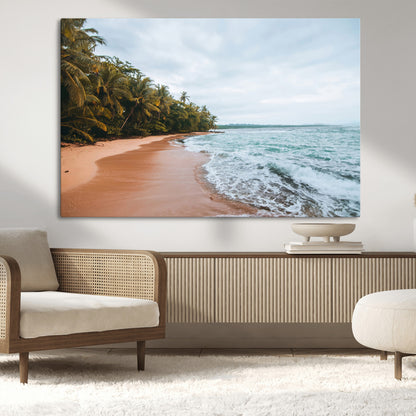 Framed canvas of a tropical beach with palm trees and soft waves, ideal for coastal escape or serene nature-inspired home decor.