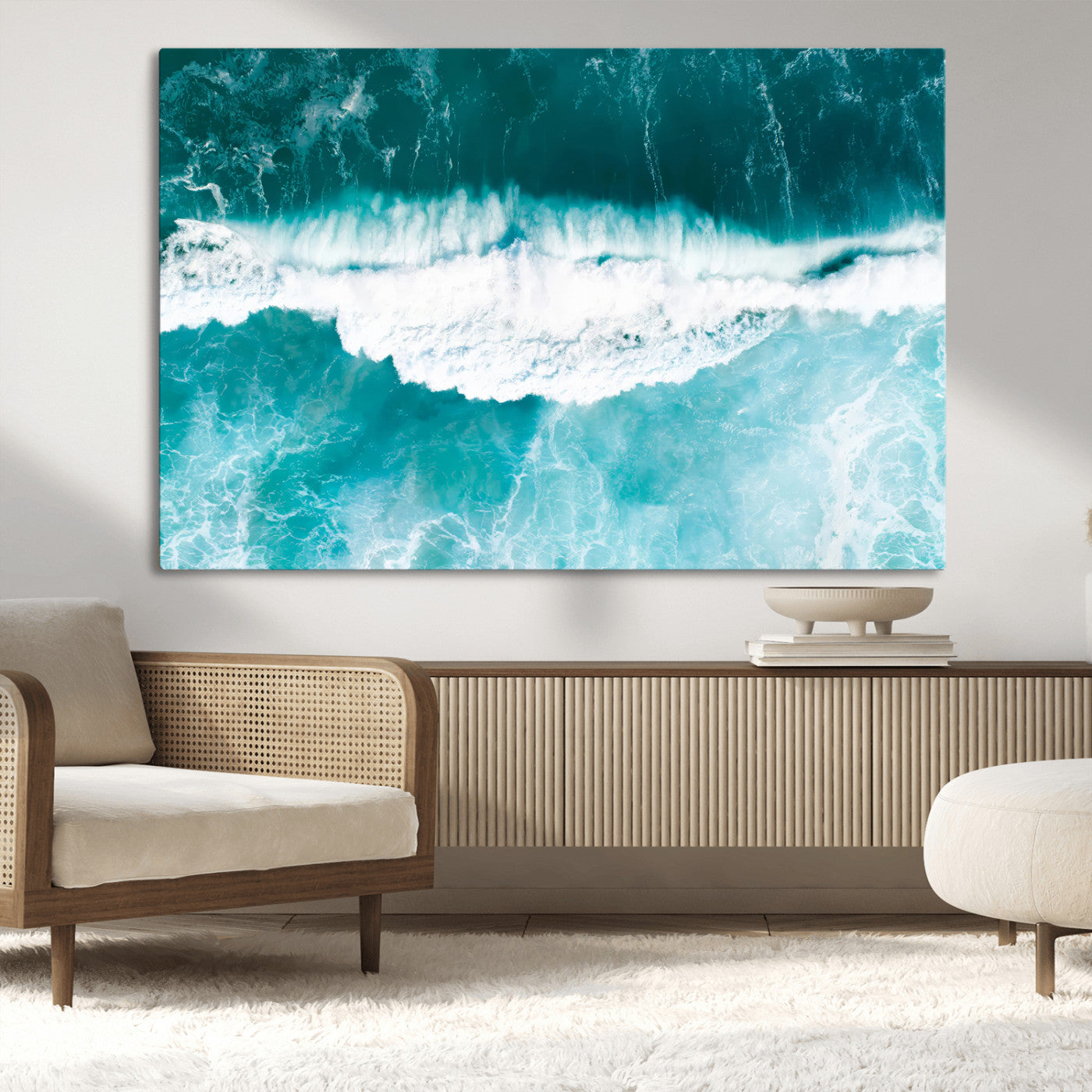 Aerial view of turquoise ocean waves crashing with white foam, perfect for tropical coastal or modern beach-style home decor.