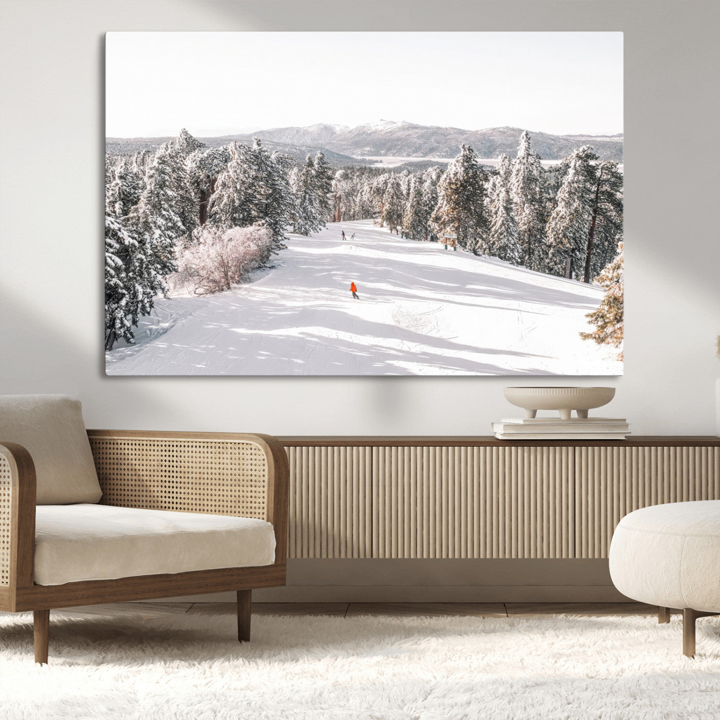 Bright ski trail lined with snow-covered pines and a skier in orange, perfect for alpine adventure or winter sports-inspired decor.