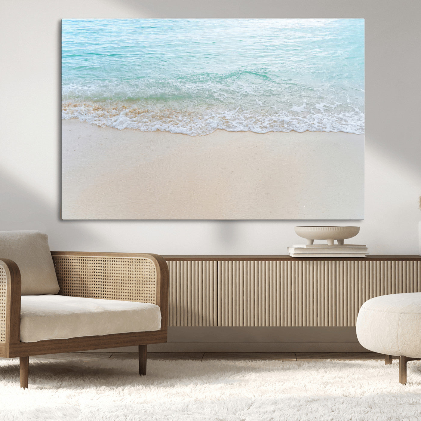 Soft shoreline with gentle aqua waves on smooth sand, ideal for minimalist coastal or pastel ocean-inspired home wall decor.