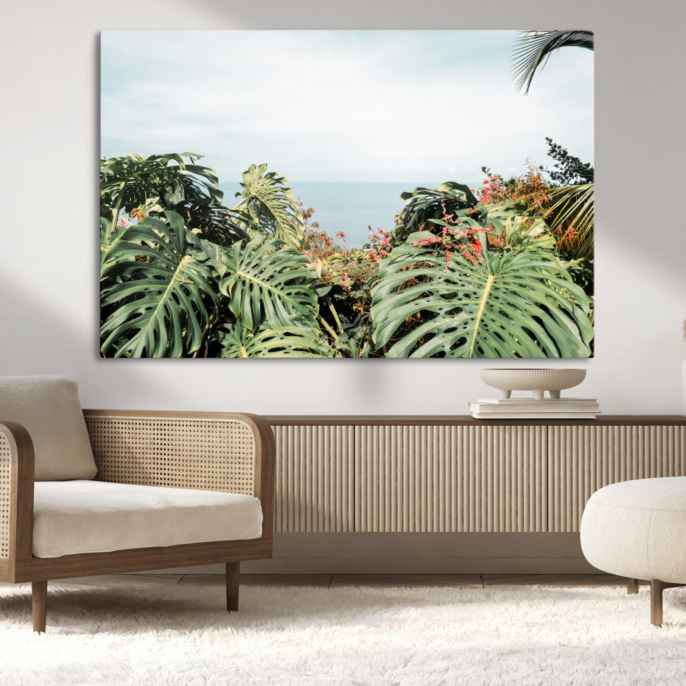 Monstera leaves and tropical flowers framing a calm ocean view, ideal for tropical coastal or exotic jungle-style interior wall decor.