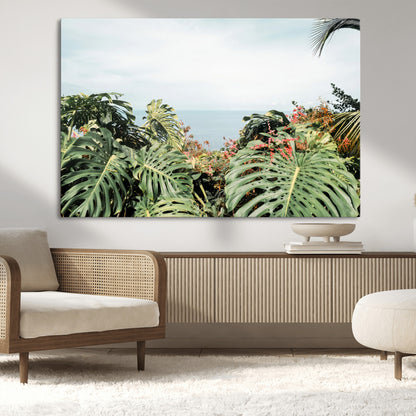Monstera leaves and tropical flowers framing a calm ocean view, ideal for tropical coastal or exotic jungle-style interior wall decor.