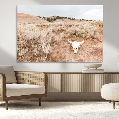 Rustic bull skull on dry sagebrush field under soft light, ideal for western minimal or desert prairie-style wall decoration.