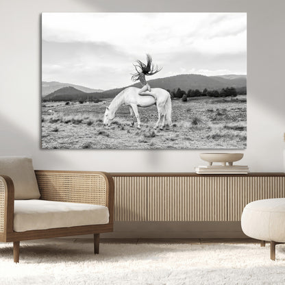 Black and white photo of a woman on a white horse in moody tones, ideal for Western Boho or modern rustic-style home decor.