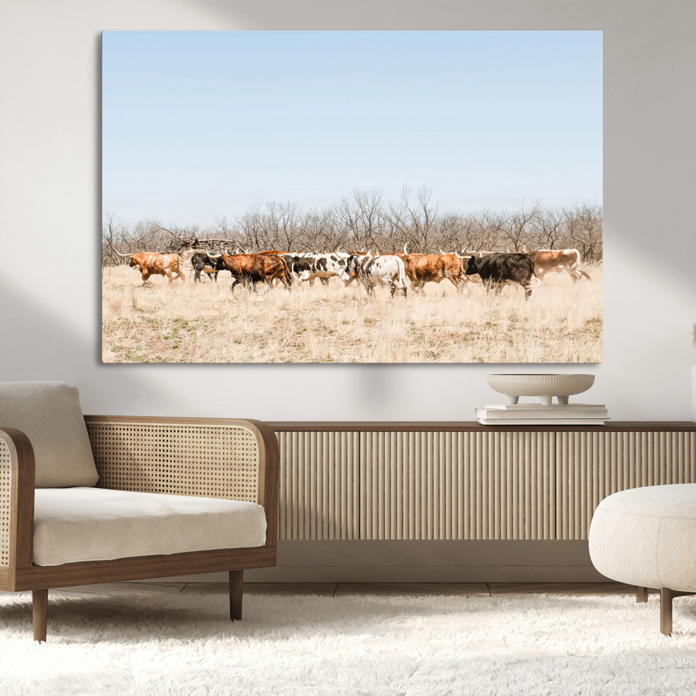 Framed wall art of Texas longhorn cattle walking through a dry, neutral-toned prairie, perfect for rustic farmhouse or western-themed home decor.