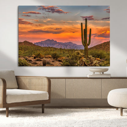 Vibrant desert sunset with saguaro cacti and distant mountains, perfect for Southwestern or warm-toned home decor.