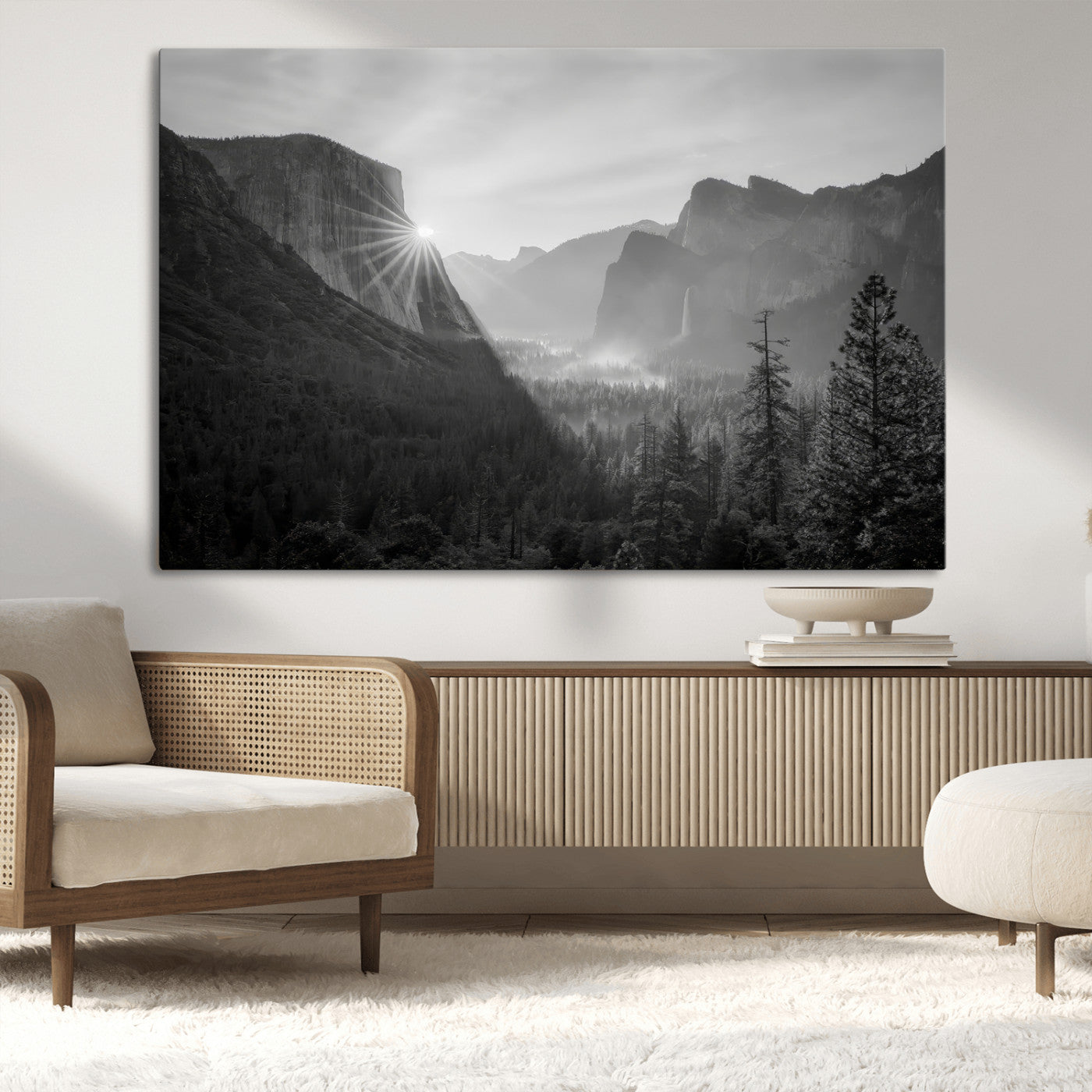 Black and white landscape of Yosemite with sun rays peeking over El Capitan, ideal for moody nature or modern rustic decor.