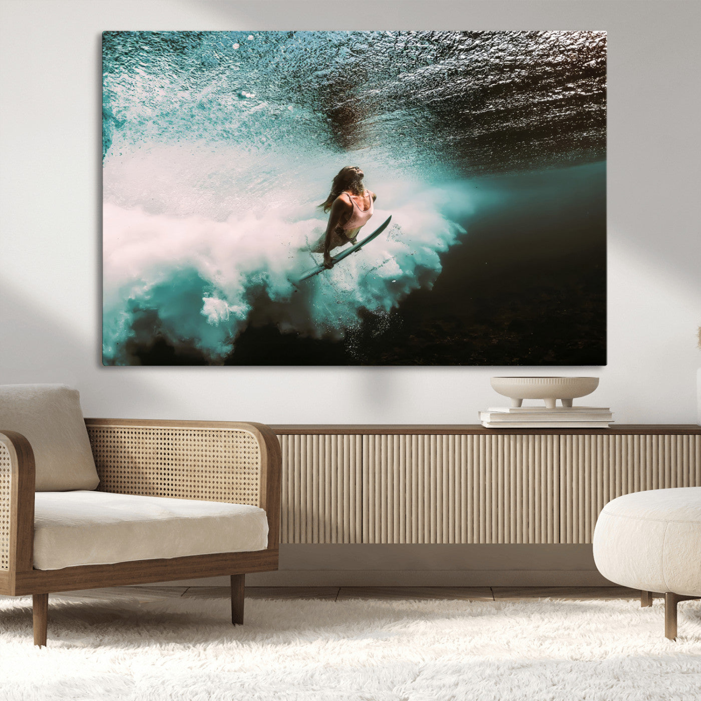 Vibrant underwater photo of a female surfer diving through turquoise waves, perfect for coastal boho or surf-inspired home decor.