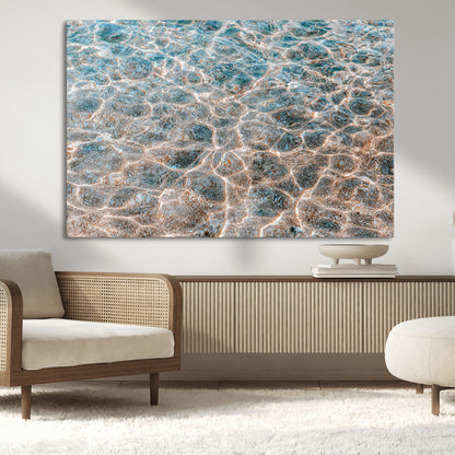 Close-up of sunlit ocean ripples with aqua blue and golden tones, ideal for modern coastal or minimalist home decor.