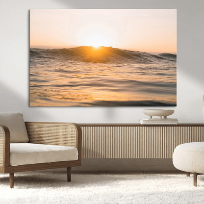 Ocean waves glowing under a warm golden sunset, reflecting soft light and calm movement, perfect for warm minimalist coastal interiors.