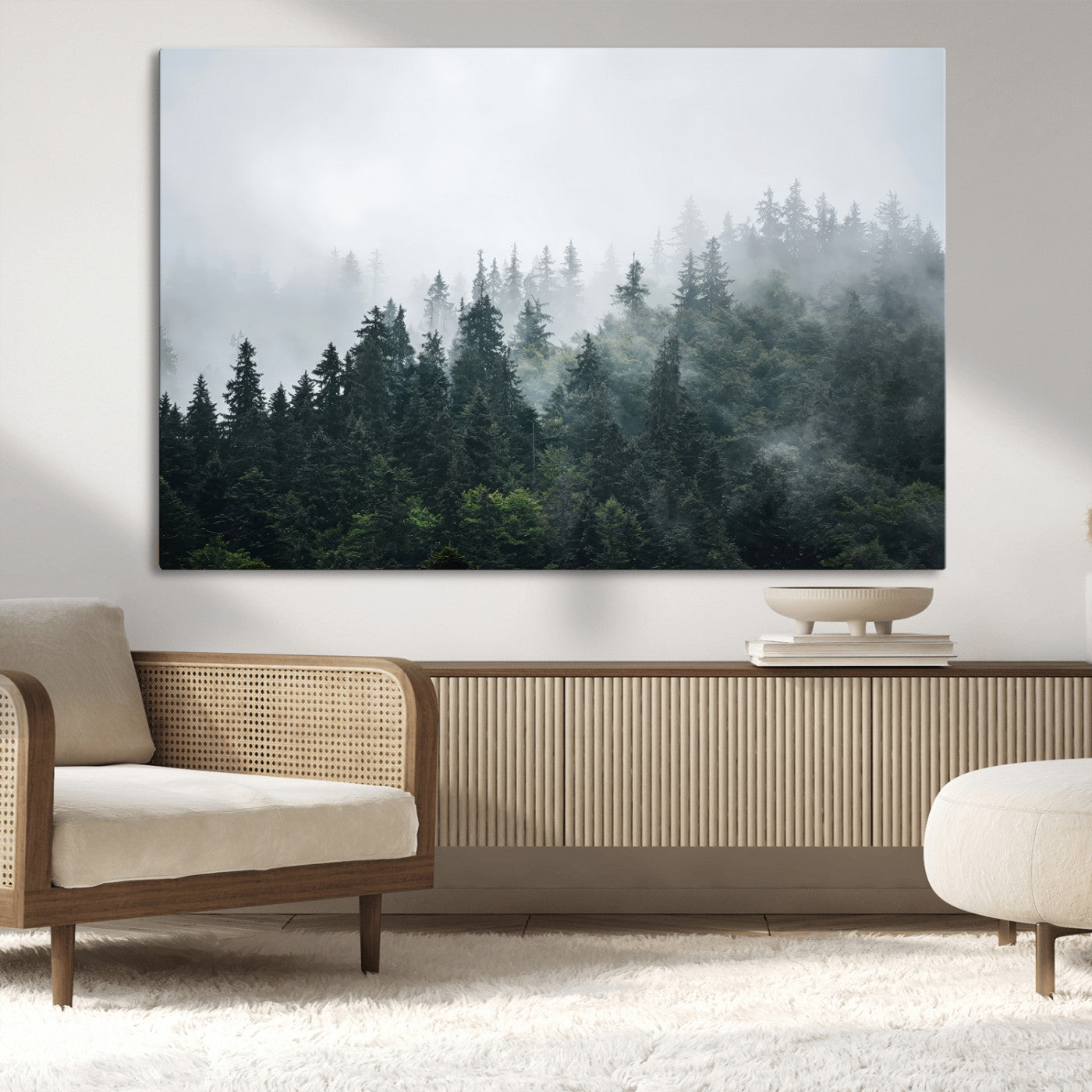 A misty evergreen forest shrouded in soft fog, creating a tranquil and moody landscape with lush green trees fading into the distance.