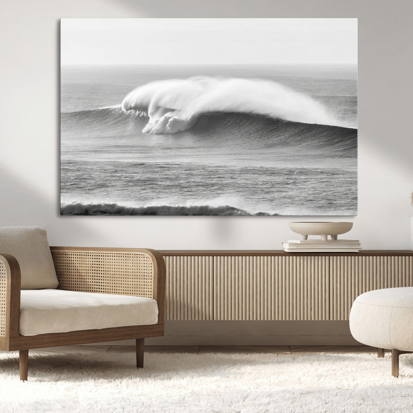 A dramatic black and white ocean wave crashing with immense force, capturing the raw power and movement of the sea in a bold seascape.