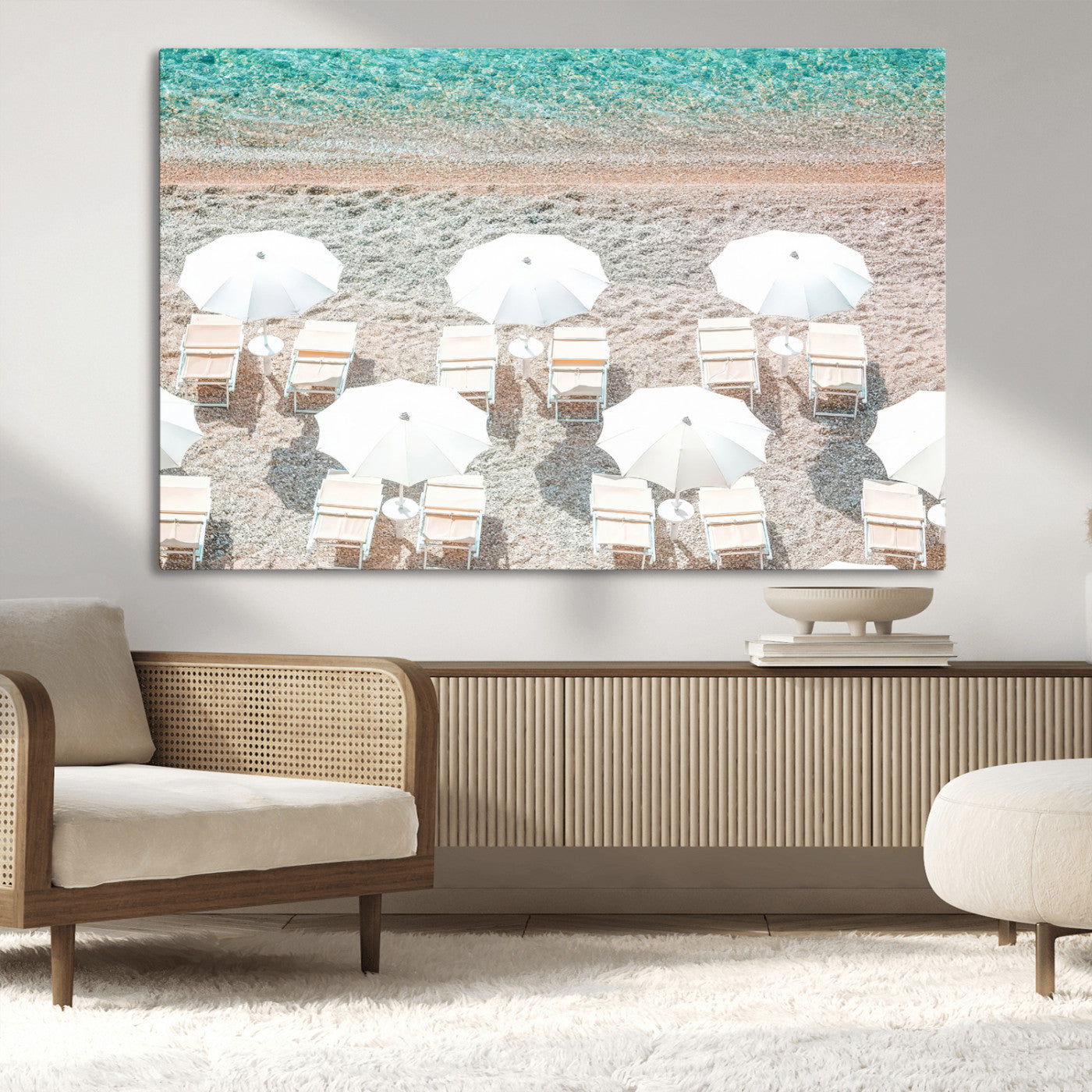 A bright beach scene with white umbrellas, pastel sand, and turquoise waters, creating a tranquil coastal vibe, perfect for beach house or summer decor.