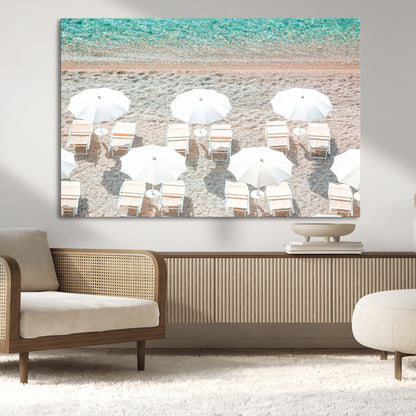 A bright beach scene with white umbrellas, pastel sand, and turquoise waters, creating a tranquil coastal vibe, perfect for beach house or summer decor.