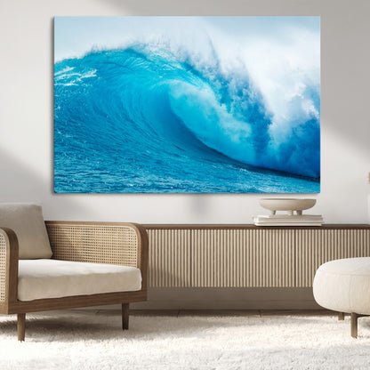 Vibrant canvas of a powerful curling ocean wave in tropical blue tones, perfect for coastal or surf-inspired decor settings.