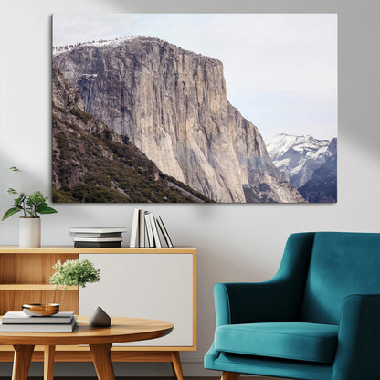 Framed canvas of El Capitan’s vertical granite face in Yosemite with snowy peaks, ideal for Sierra minimalism or mountain-inspired decor.