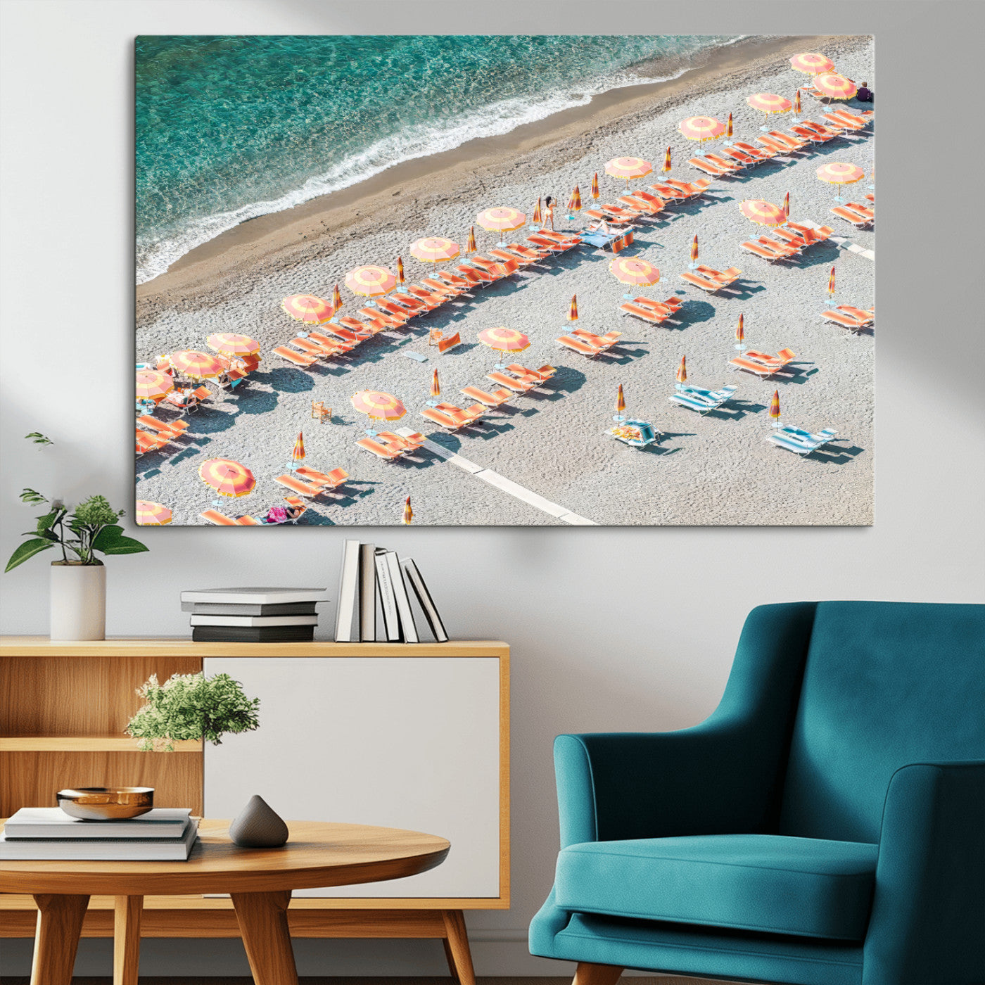 Framed canvas of colorful umbrellas and chairs on a Mediterranean beach, perfect for retro coastal or summer-themed home decor.