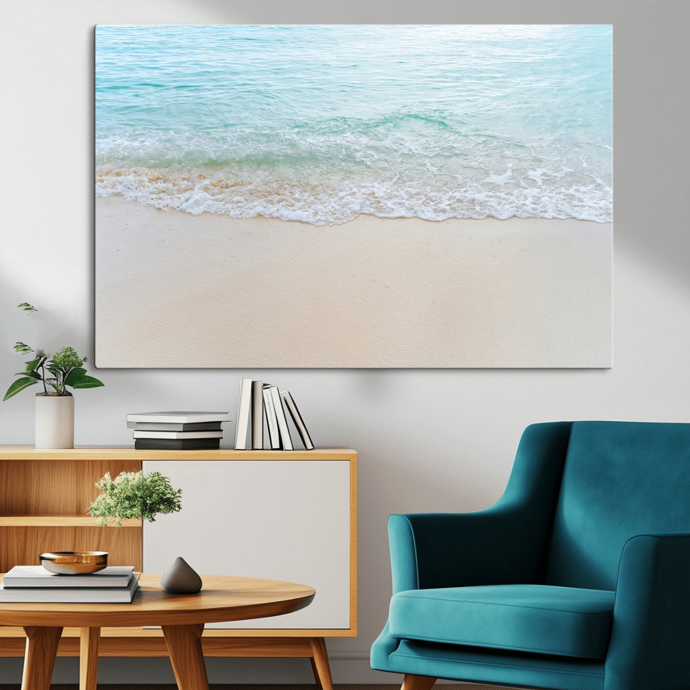 Soft shoreline with gentle aqua waves on smooth sand, ideal for minimalist coastal or pastel ocean-inspired home wall decor.