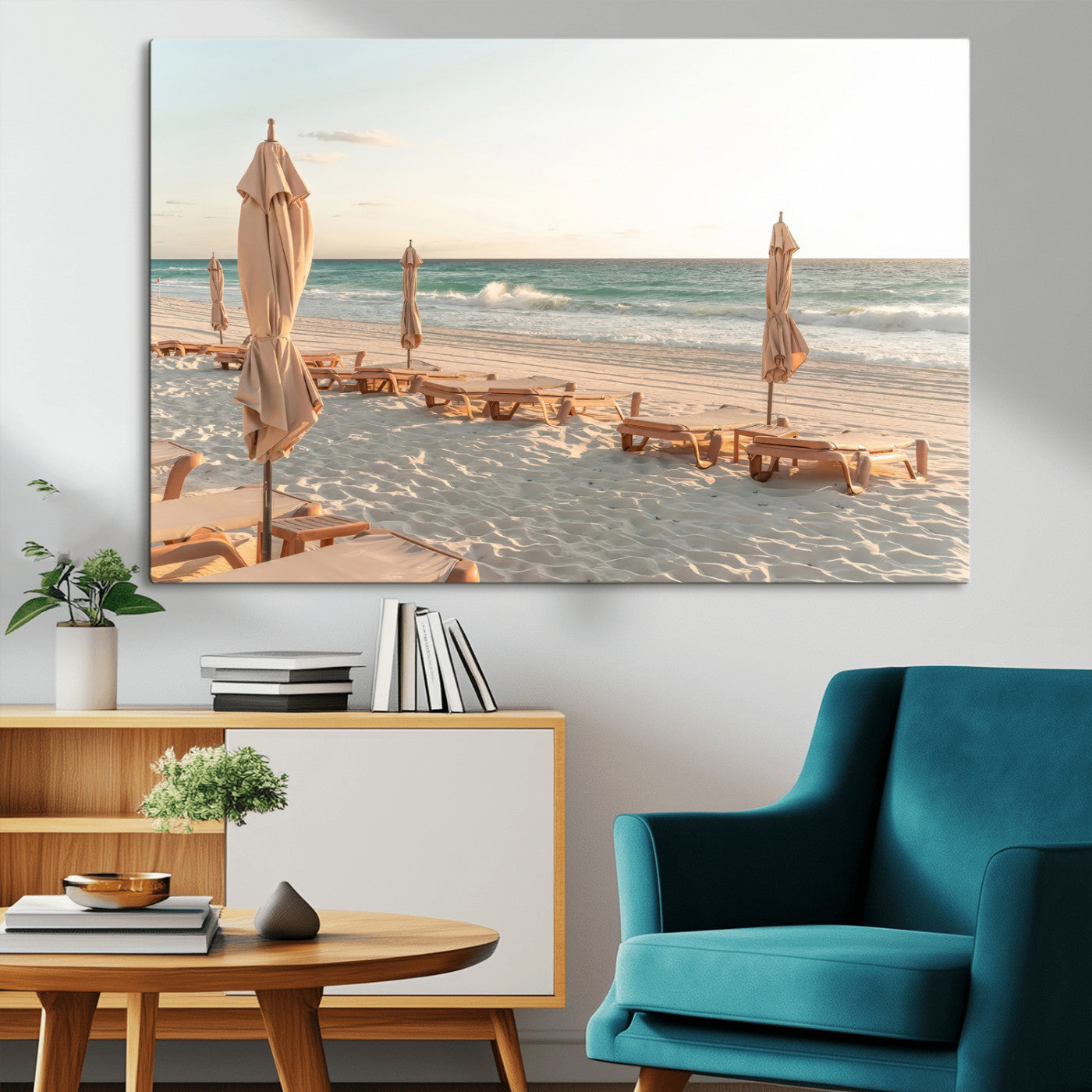 Minimalist photo of empty beach loungers and umbrellas on soft sand, ideal for calm seaside or pastel coastal-style home decor.
