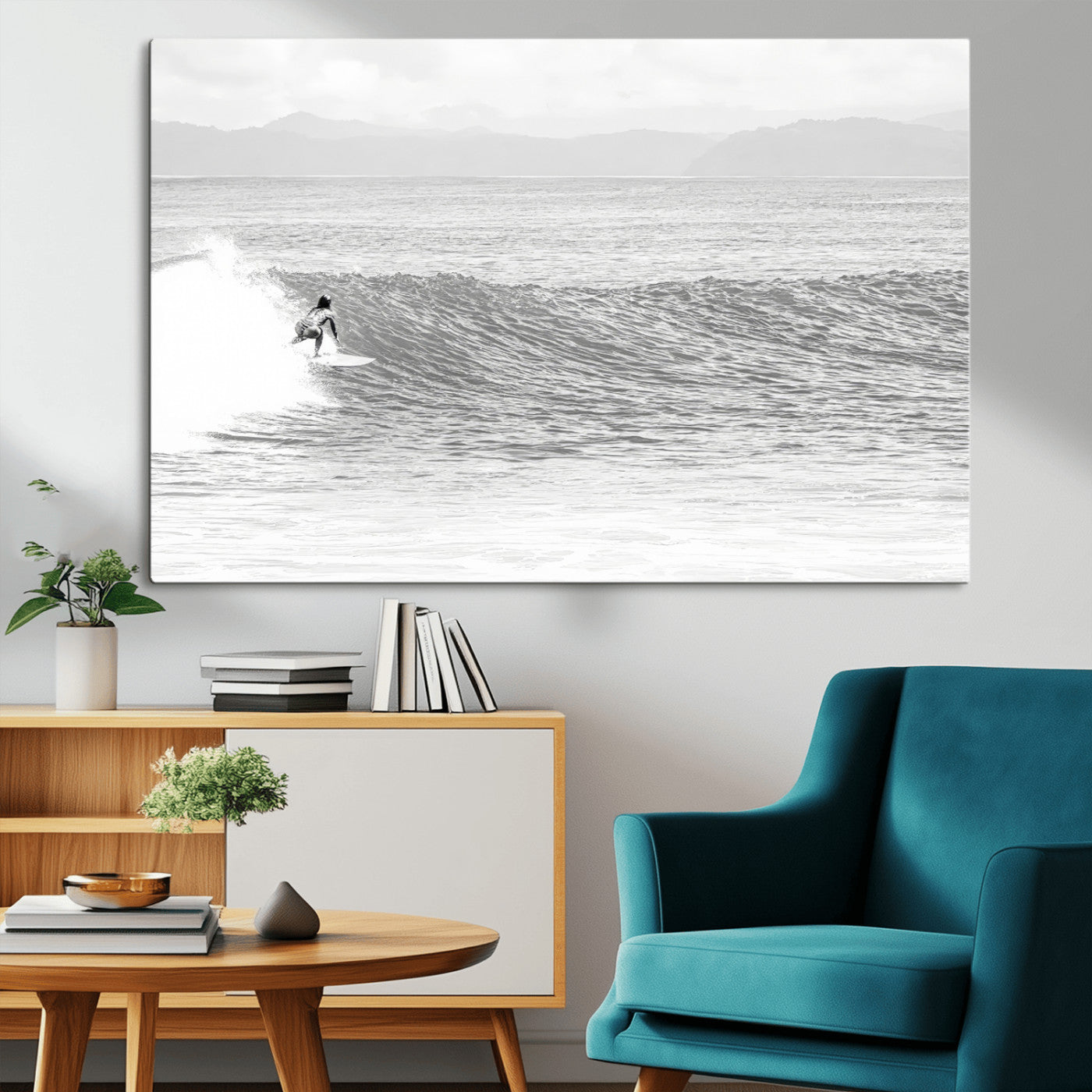 Monochrome photo of a surfer riding a wave with distant mountains, ideal for coastal motion or black and white surf-themed wall decor.