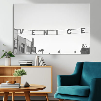 Black and white photo of Venice Beach sign and palm-lined street, perfect for urban coastal or minimalist LA-inspired wall decoration.