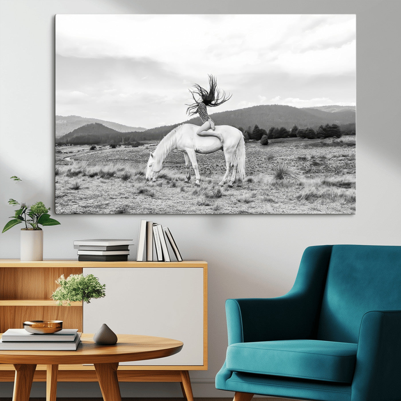 Black and white photo of a woman on a white horse in moody tones, ideal for Western Boho or modern rustic-style home decor.