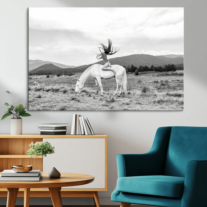 Black and white photo of a woman on a white horse in moody tones, ideal for Western Boho or modern rustic-style home decor.
