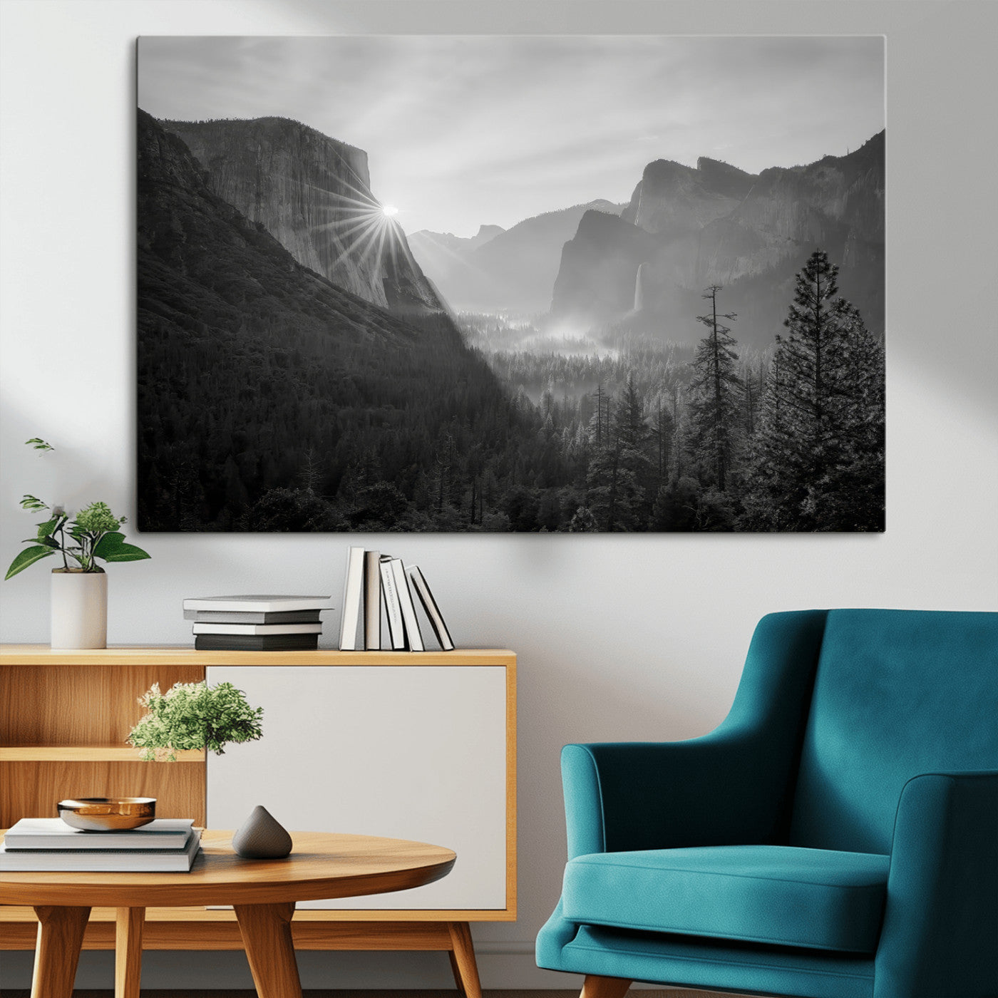 Black and white landscape of Yosemite with sun rays peeking over El Capitan, ideal for moody nature or modern rustic decor.