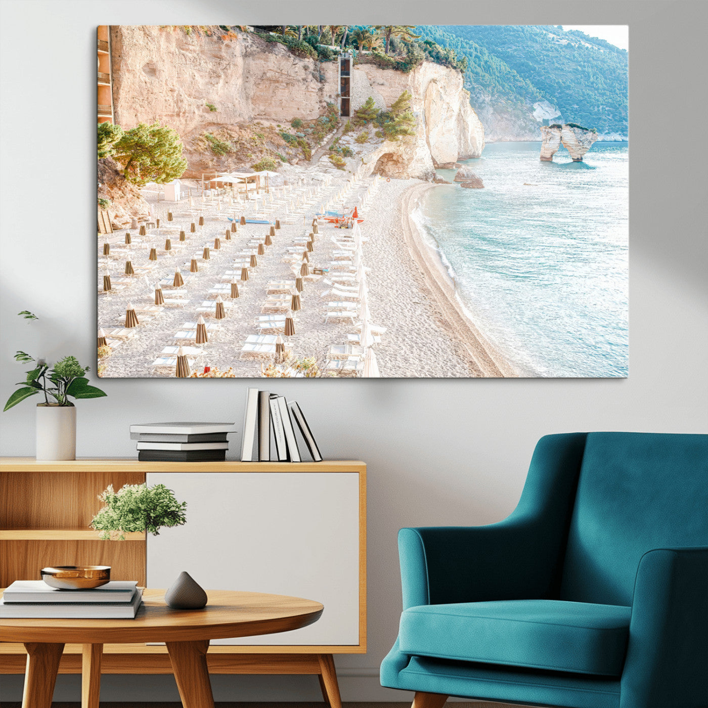 Wall art of a calm Mediterranean beach with rows of sun loungers and umbrellas in soft pastel tones, perfect for light coastal or vacation-themed decor.