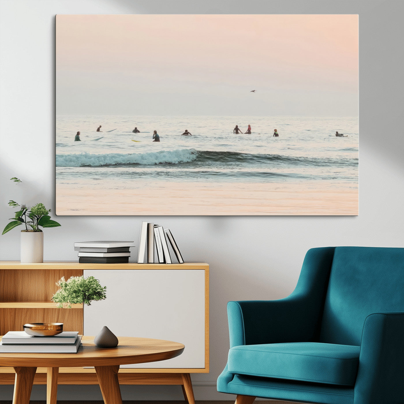 Dreamy photo of surfers waiting on soft pastel waves under a pink sunset sky, ideal for soft coastal minimalist or serene ocean-themed home decor.